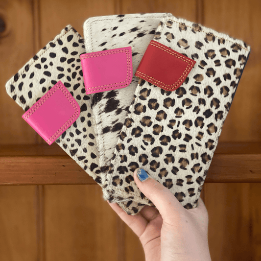 Becca animal print leather wallet with bright strap detailing