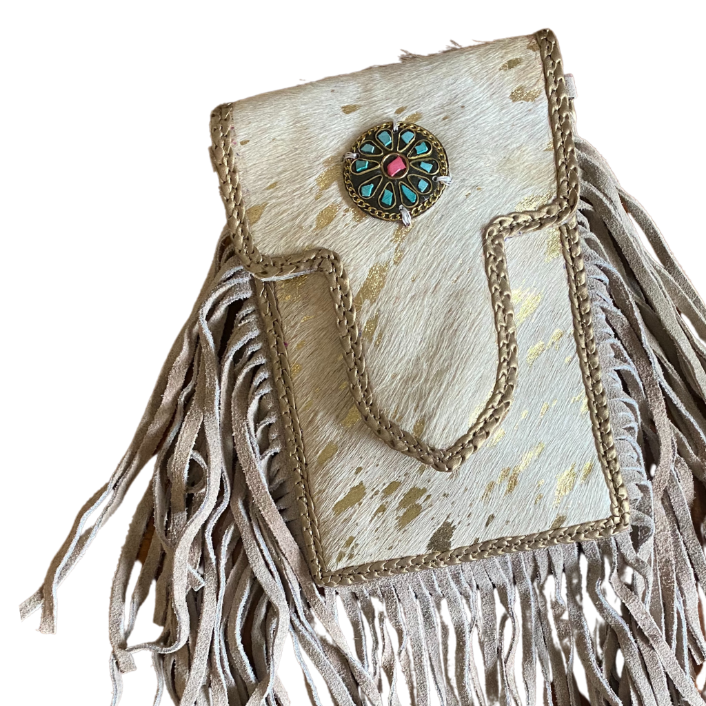 Leather mini tassel bag with gemstone front styled with hat and sunglasses