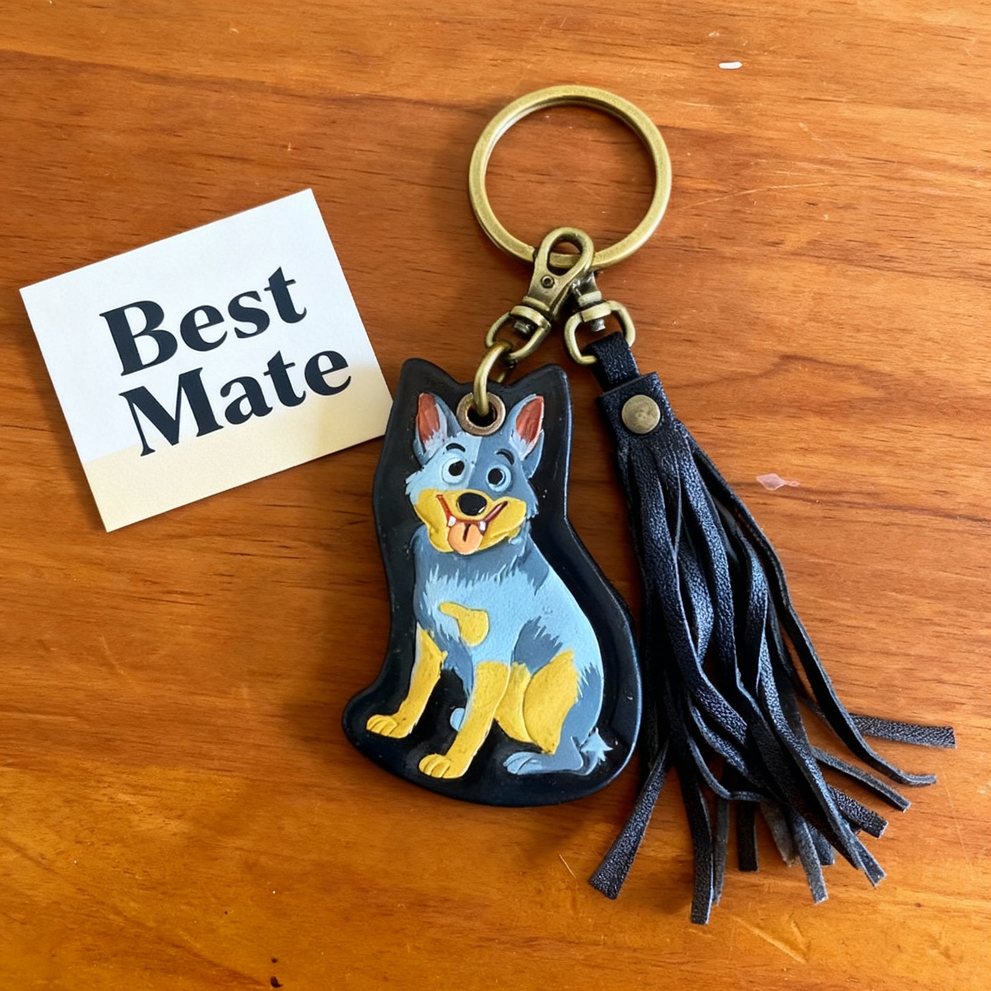 Cattle Dog keychain with tassel styled on rustic timber surface