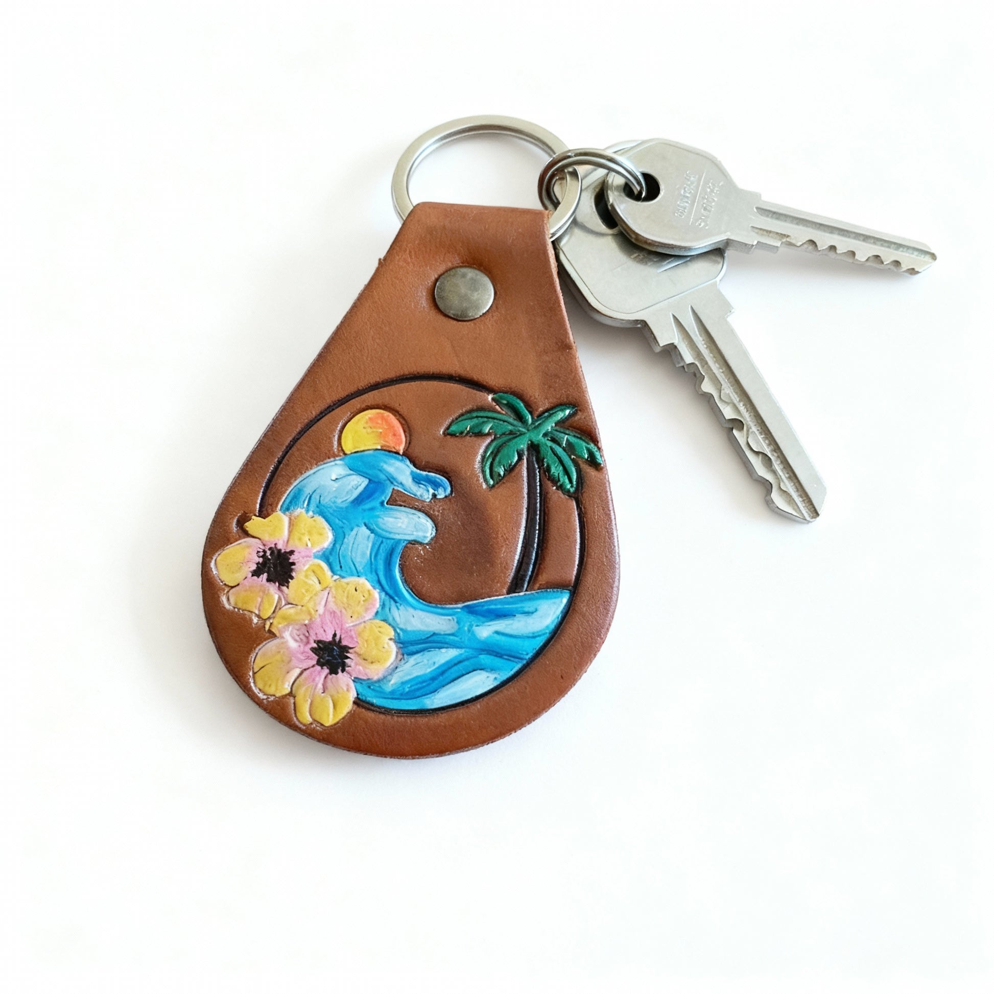 Close-up detail of ocean charm beach keychain with silver ring