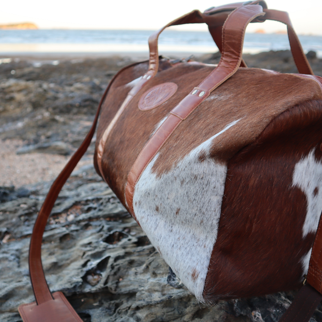 australia cow hide, duffle bag, travel bag, weekend bag, brown, black, tan, real cowhide, leather, australian leather